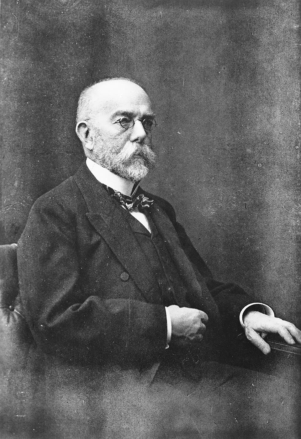 Robert Koch, who proved that particular bacteria cause particular diseases and invented the methods for growing them (Wellcome Collection, CC BY 4.0). Right: Alexander Fleming in his laboratory with plates of the mould whose product became penicillin (U.S. Navy archive, public domain).
